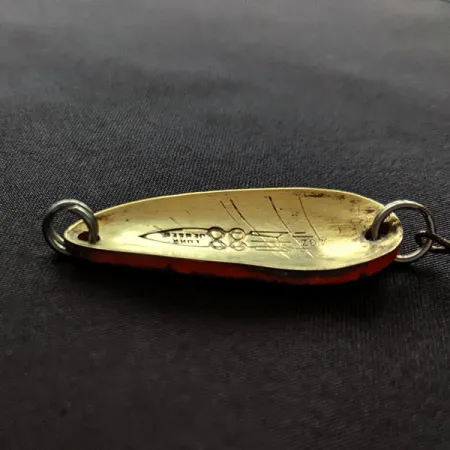 Luhr Jensen Rocket 88 UV, mosiądz/czarny/czerwony UV, 9 g błystka wahadłowa #20095